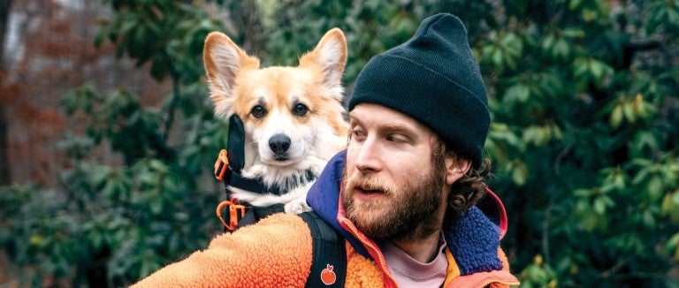 Bryan Reisberg with his corgi, Maxine, strapped into his self-designed backpack.